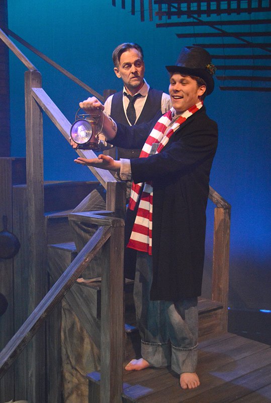 Christmas Present (Lewis Youngren) gives Scrooge (Ben Gorman) a tour of Christmas